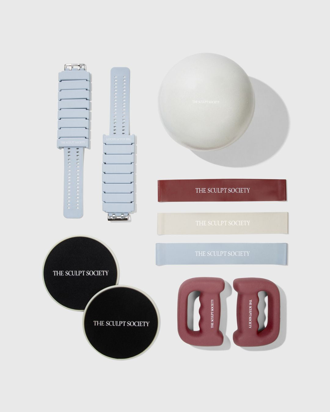 All You Need Equipment Bundle featuring 1 lb ankle weights, pilates ball, bands, sliders, and 5 lb handweights